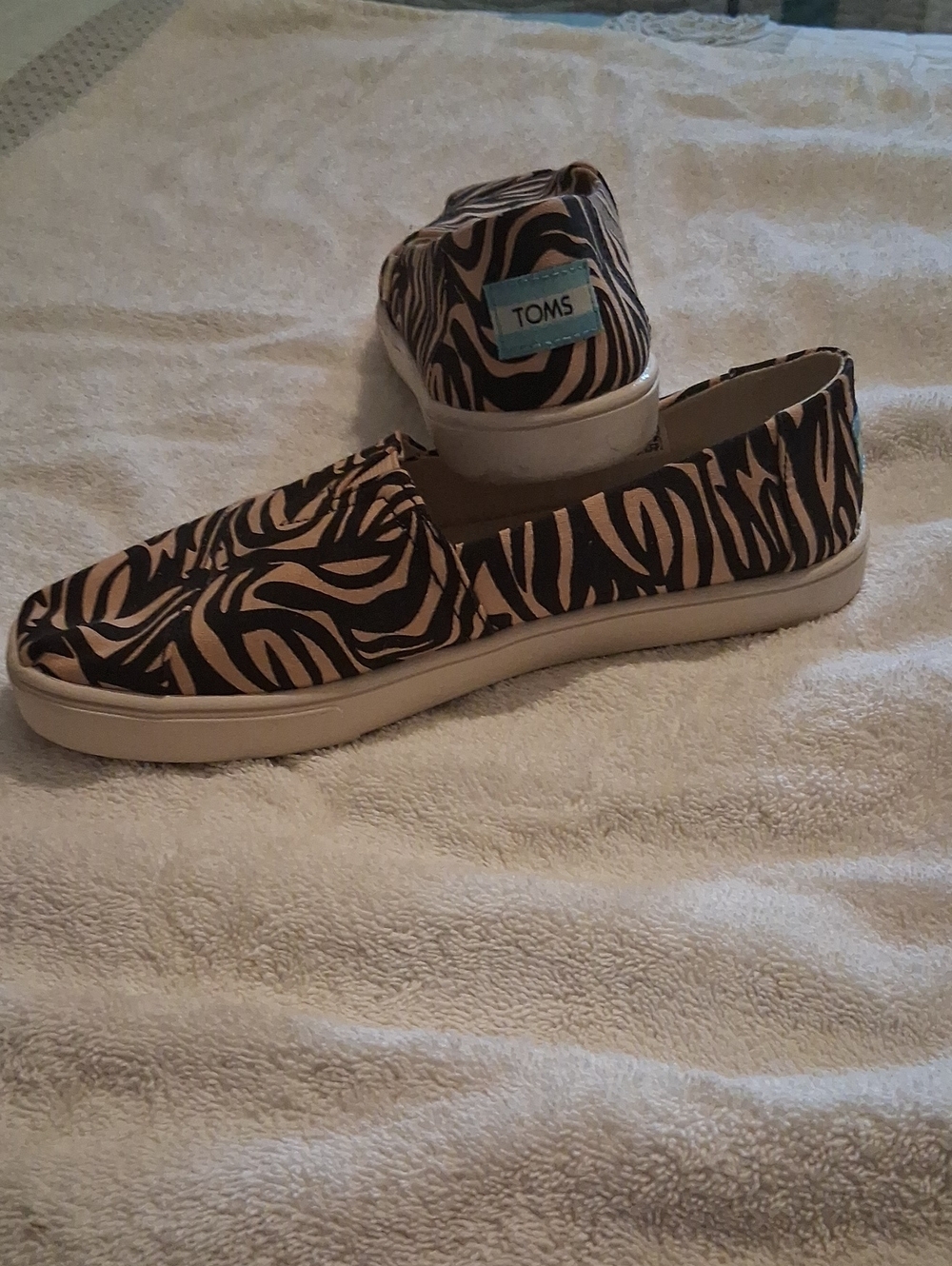 Toms Black and Tan Zebra-Pattern Slip-Ons